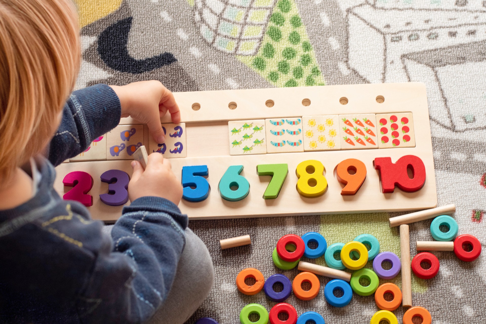 Baby toddler early development. Wooden stack and count rainbow colors learning game. Child learn colors and numbers